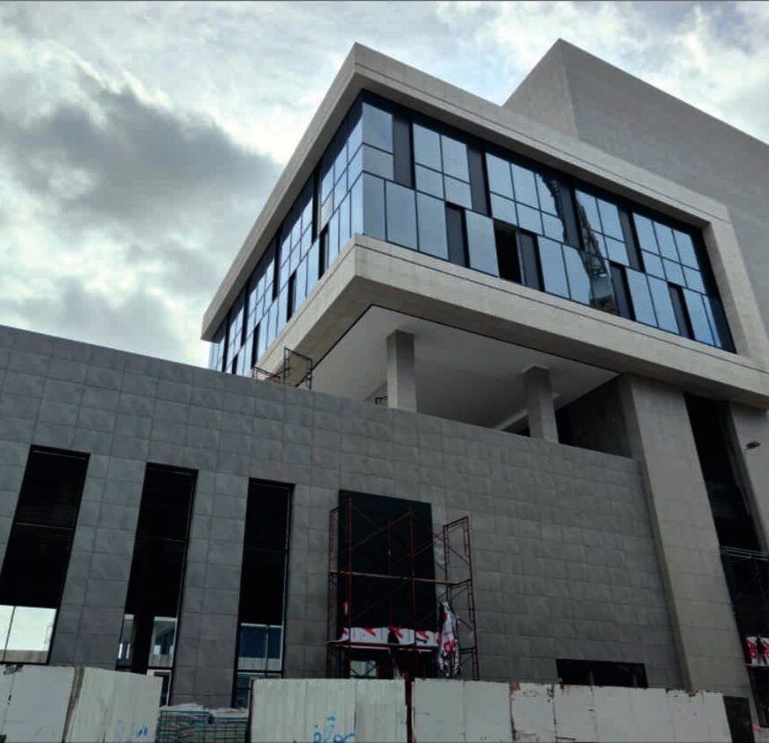 Office building — external cladding and glazing complete.